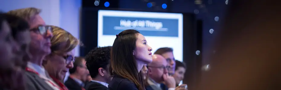 Members of the audience listening to a MBA networking speaker