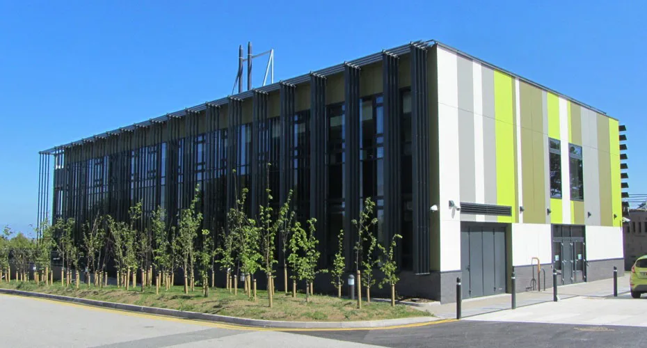 The science and engineering research support facility, featuring green and yellow striped exterior, located at penryn campus.