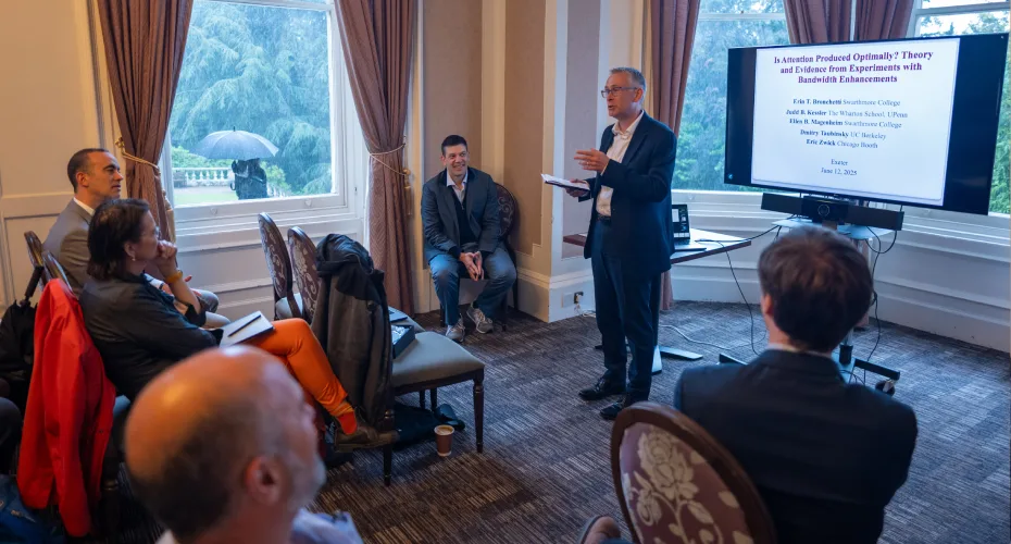 A speaker addresses a group, sharing insights and information during a professional presentation.