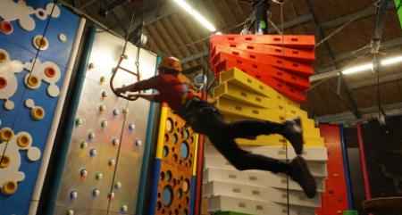 Student jumping at the climbing centre