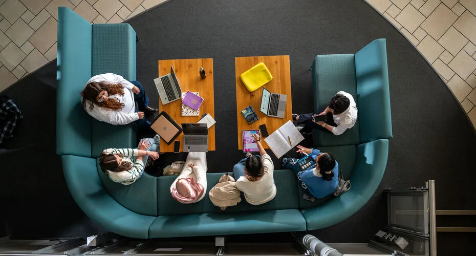 A group of business students working together on a project.