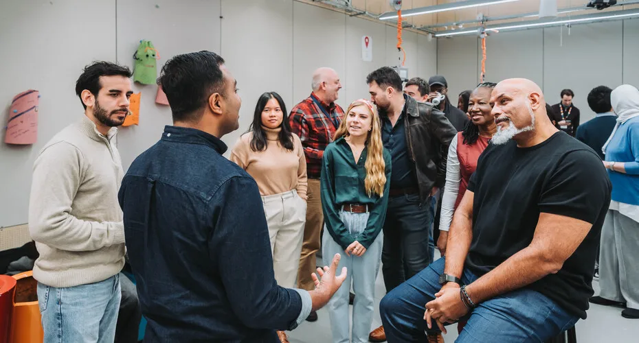 Mba students engaged in workshops and group exercises. Visiting speaker john amaechi obe.