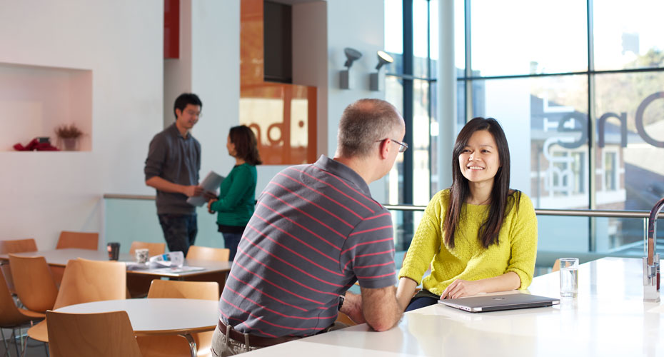 Staff talking in the Building One cafe