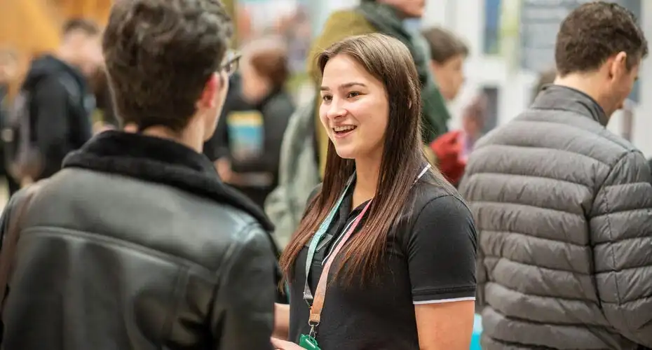 A current student talking to a prospective student at an Offer Holder Day